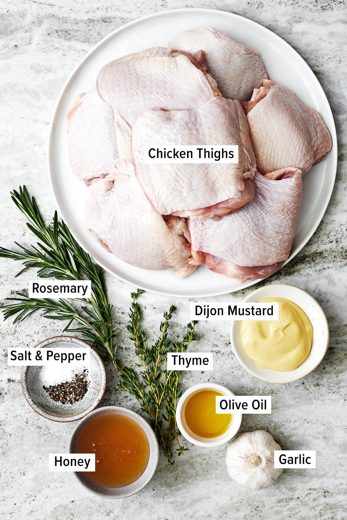 Ingredients for baked honey mustard chicken thighs on a table