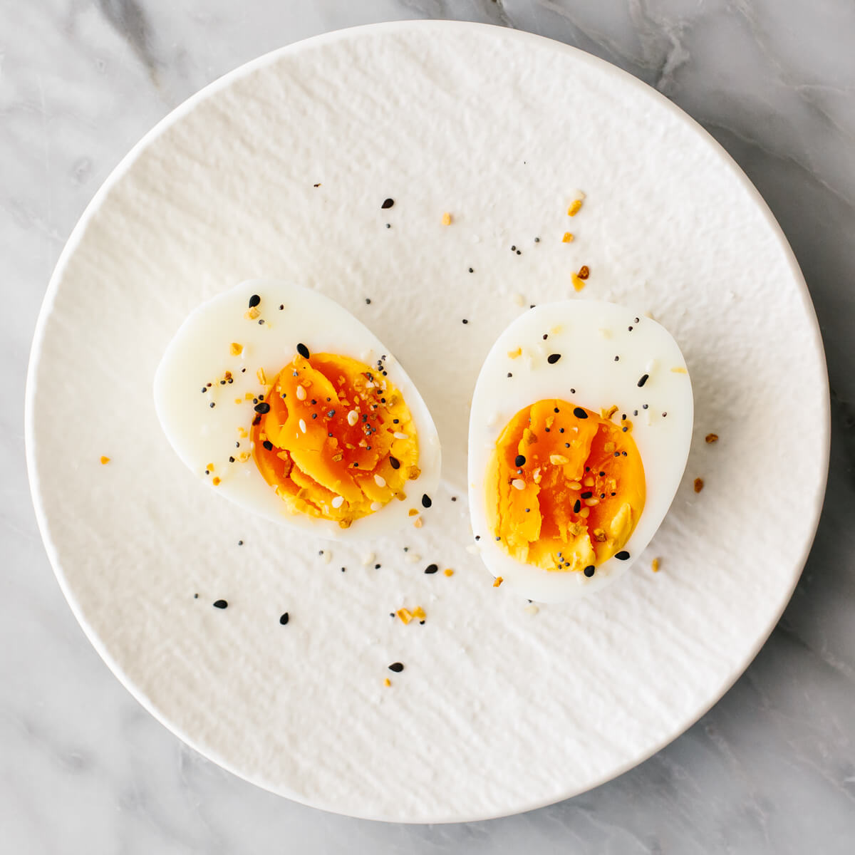 Boiled egg with seasoning on a plate