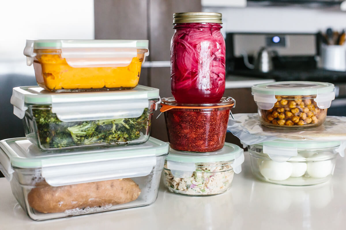 Stacked containers on a table for a healthy budget meal prep