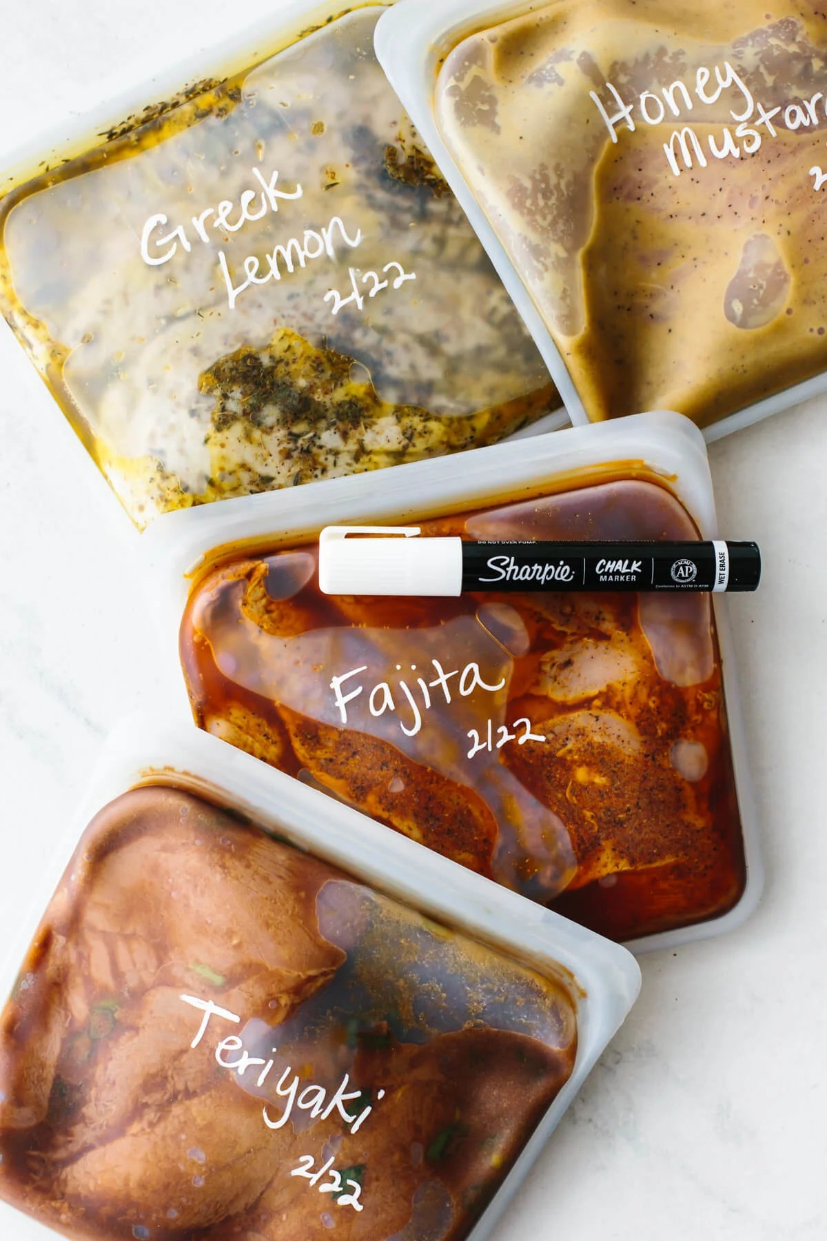 Chicken marinades in bags with a sharpie