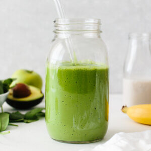 A glass jar of green smoothie