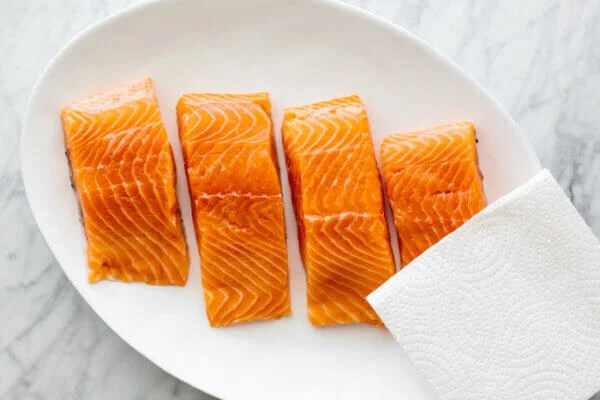 A plate of raw salmon for air fryer salmon