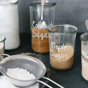 Different types of sugar in jars.