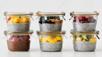 Chia pudding meal prepped with fresh fruit in glass containers.