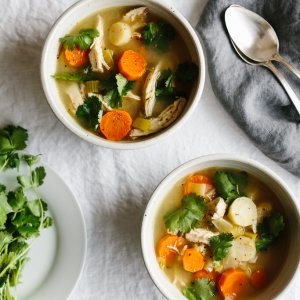 Poached chicken and vegetable come together for a nourishing, hearty, healing soup recipe. With carrots, parsnips, celery, leek, onion, garlic and fresh herbs, this is a great cold weather vegetable soup.